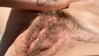 Hairy Milf Enjoys Outdoor Sunbathing And Stimulating Her Clit