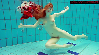 Young Polish Woman With Red Hair Strips In Swimming Pool